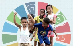 Global Health Progress campaign image - a group of children in front of the SDG wheel